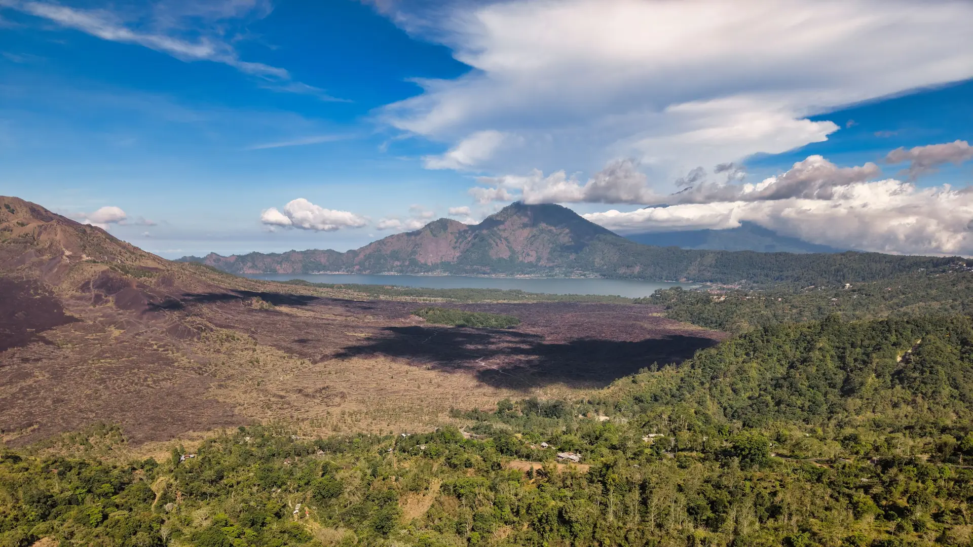 Aerial view of Mount Batur and its caldera, with Lake Batur to the side